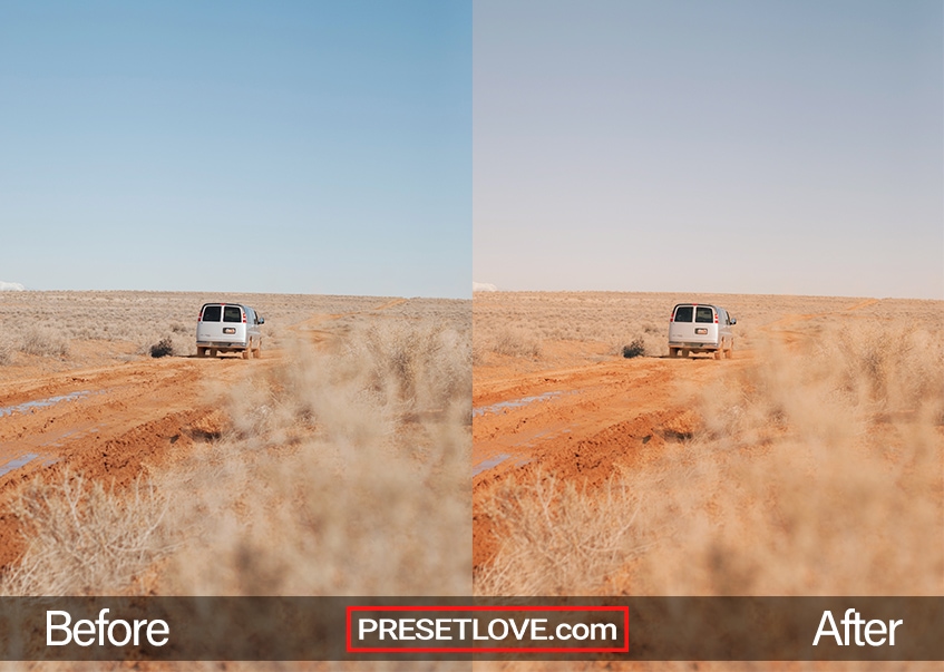 A warm film photo of a van driving in the middle of a barren field