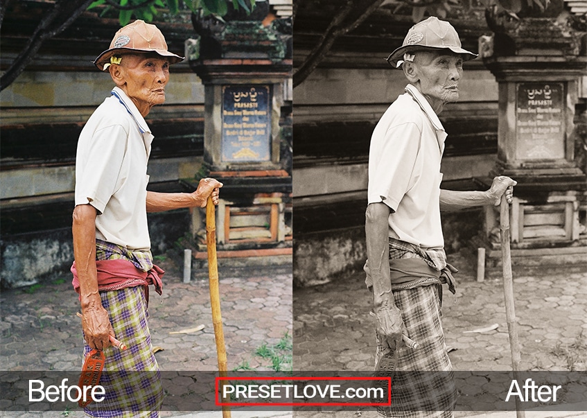 A film monochrome portrait of an old mean walking supported by a bamboo cane