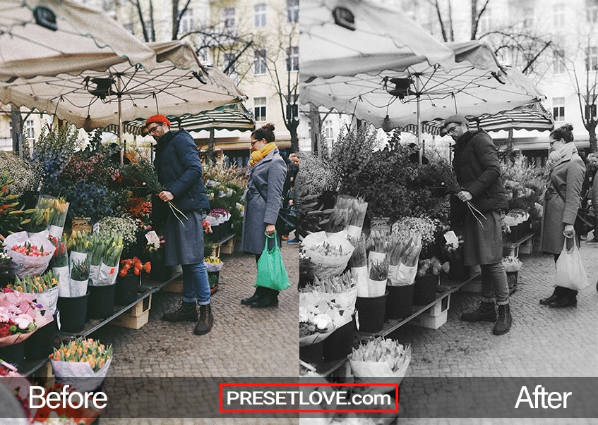A smooth black and white photo of people buying at a flower stand