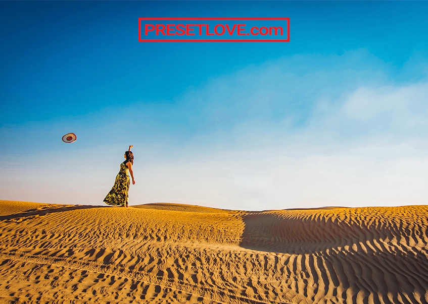 A woman in the middle of a desert
