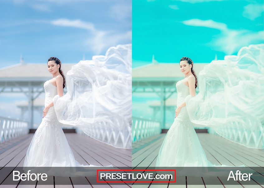 Exotic bridal photo on a dock with wind-swept train and blue sky