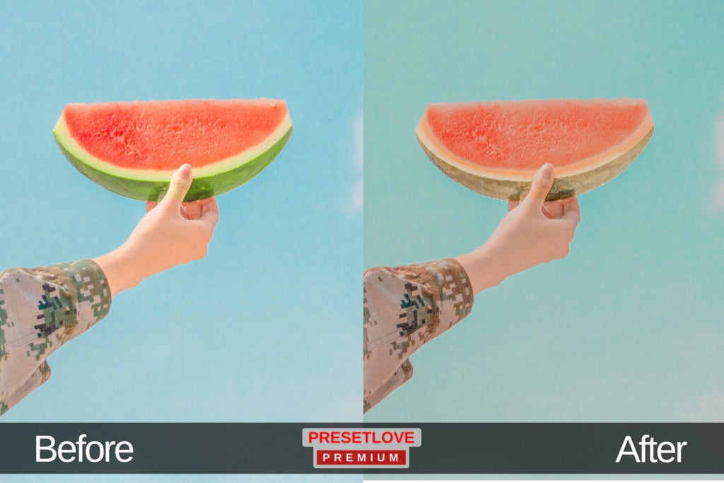 A warm photo of a hand holding up a slice of watermelon