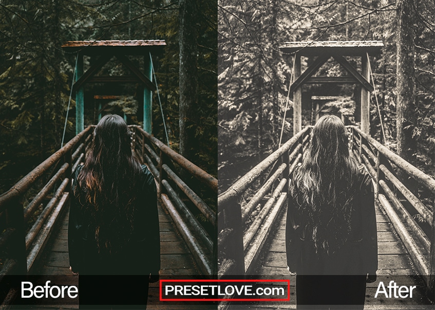 A woman crossing a wooden bridge in a forest