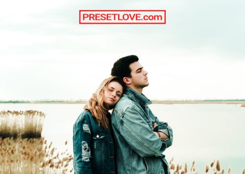 A bright photo of a couple in denim jackets