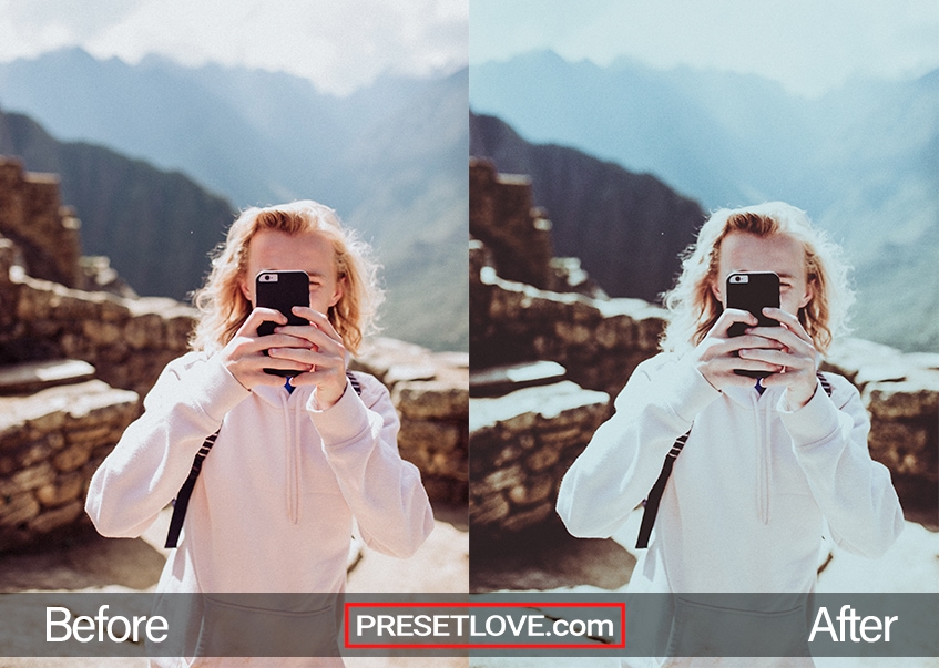 A cool blue outdoor portrait of a woman wearing a hoodie while hiking