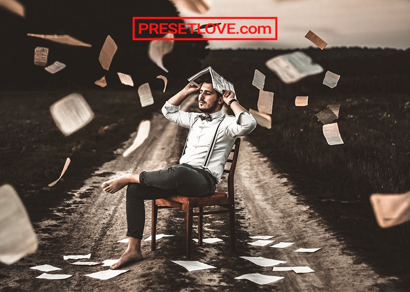 A cinematic photo of a man sitting on a chair while holding an opened book on his head