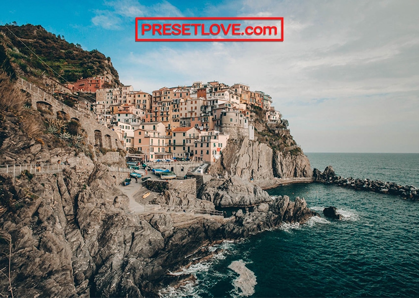 A warm and vibrant photo of the Cinque Terre, with a film travel preset applied
